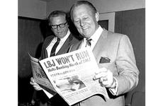 During a visit to Stars and Stripes; Tokyo office on April 2, 1968, TV host Art Linkletter checks out a copy of the paper with a headline about President Lyndon Johnson's decision not to run for re-election.