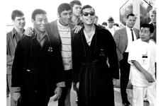 Joe Namath poses with a group of servicemembers at Camp Oji, Japan, in January, 1969.