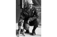 Maj. Roger Donlon, the first Medal of Honor recipient in the Vietnam war, poses outside his headquarters tent at the Advanced Combat Training Academy.