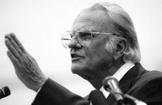 Evangelist Billy Graham conducts a Sunday service at Yokota Air Base in January, 1994.