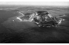 Mount Suribachi, as seen from a plane carrying Iwo Jima flag raiser Rene Gagnon and his family to the island in February, 1965.