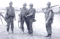 Marine Cpl. Gregory Harris, second from right, is seen here smiling with friends in Vietnam.