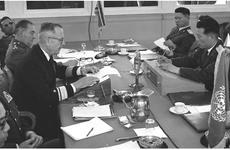 Rear Adm. John V. Smith reads a list of charges to North Korean Gen. Chung Kook Pak across the conference table at the 266 meeting of the Military Armistice Commission in April, 1968, days after four U.N. Command soldiers were killed in an ambush at the DMZ.