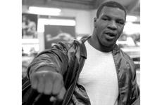 Mike Tyson strikes a boxing pose as he arrives for a workout in Tokyo in February, 1988.