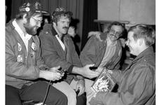 Pfc. Gary Rundell of 1st Battalion, 3rd Infantry is given a football book by Ray Mansfield, Tom Mack and Rocky Bleier during a drawing at Camp Greaves, near the Korean DMZ.