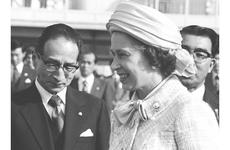 Queen Elizabeth walks to the plane at the conclusion of her visit to Japan.