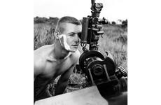 South Vietnam, July, 1965: A fire mission caught Sgt. Homer Charnock of Bravo Battery, 319th Artillery, in the middle of shaving.