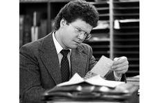 Author James Webb, in the process of writing his third novel, looks through newspaper clippings during a 1983 visit to Tokyo.