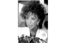 Actress Elizabeth Taylor speaks at a Tokyo news conference in 1987.
