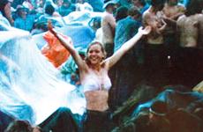 David Allen's 19-year-old sister, Kathy, frolics in the rain at Woodstock, catching the attention of the film crew.