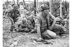 Marine Corps Staff Sgt. Bob Thoms assesses the situation before leading an assault on the Dong Ba Tower, considered a crucial objective for U.S. forces in the fierce battle for the city of Hue.