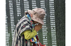 A woman prays for loved ones lost in the Battle of Okinawa during the annual Irei no Hi ceremony at Peace Memorial Park in Okinawa, Japan, June 23, 2019.