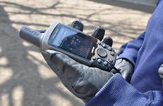 Tech. Sgt. Robert Slagle checks the satellite strength on his hand-held GPS device during a demonstration in Misawa City in April. Slagle is president of the Misawa Geocachers Organization at Misawa Air Base, Japan.
