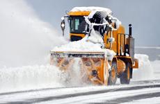 A worker with the 35th Civil Engineer Squadron’s heavy repair section plows the air field on Wednesday morning following 14 inches of overnight snow at Misawa Air Base, Japan.