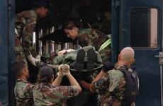 Airmen move a mock victim during the transportation stage of a training exercise in 2005 at Yokota Air Force base.