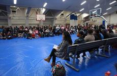 Large crowds gather Friday at Halsey Gym at Naval Air Facility Atsugi, Japan, to find out more information about the voluntary evacuation. Planes carrying family memebers are expected to start leaving Japan this weekend