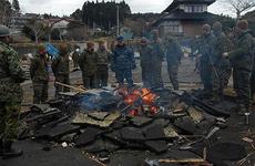 Rear Adm. Jeffrey S. Jones speaks with members of the 31st Marine Expeditionary Unit about ongoing disaster relief efforts on Oshima Island, Japan, on April 4.
