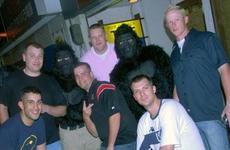 Airmen and sailors from Misawa Air Base, Japan, stop for a photo with two Monkeys Against Drunk Drivers volunteers on Aug. 8. Members of the 35th Maintenance Squadron’s Accessories Flight came up with the idea to give free rides after a recent spate of alcohol-related incidents.