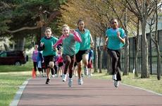 Members of the 'Go Girls Go' club run during a training session on Misawa Air Base, Japan.