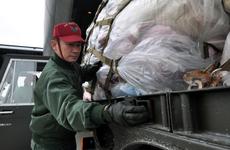 First Sgt. Yoshihiro Kamamoto, a member of the Japan Air Self-Defense Force, helps unload a pallet of donated blankets from a U.S. Navy C-130 on Sunday at Misawa Air Base, Japan.