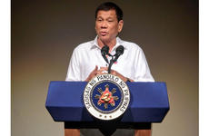 Philippine President Rodrigo Duterte speaks to the Philippine Economic Forum in Tokyo, Wednesday, Oct. 26, 2016. Duterte said he wants to end his nation's reliance on foreign military assistance.