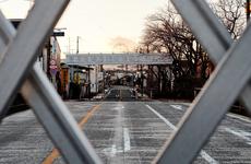 The remains of a sign reading ''Nuclear power: Energy for a bright future'' stands over the barricaded road along National Route 6 in the ghost town Futaba, Japan, less than 10 miles from the severely damaged Fukushima Dai-ichi nuclear power plant.
