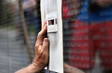 Preparing to cut another name into the black granite of the Vietnam Veterans Memorial Wall.