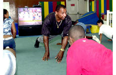 Staff Sgt. Tony Webb leads the kids at Kadena in exercises.