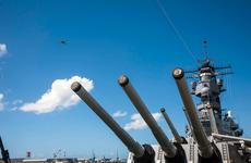A World War II-era warbird flies over the Battleship Missouri Memorial, moored in Pearl Harbor, Hawaii, during an aerial parade Aug. 30, 2020, as part of the 75th Anniversary of the End of WW II Commemoration.