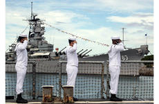 Sailors aboard the guided-missile destroyer USS Michael Murphy render honors to the Battleship Missouri Memorial in Pearl Harbor, Hawaii, during a ceremony Sept. 2, 2020, for the 75th commemoration of the end of World War II.