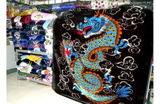Mink blankets are among the most popular "must-have" items for those visiting or living in Korea. Here a shop has stacks of blankets in every color and design, ranging in price from $18 to $25.00.