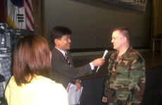 Capt. Richardson Blair IV is interviewed by Japanese television after a rousing speech that garnered him first place in the 8th annual Korean language speech contest Wednesday at Balboni Theater.