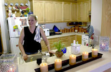Cathy McGinn, a mother of six, stands in the kitchen of her new five-bedroom apartment in the Lloyd L. Burke Towers. Monday marked the opening ceremony for two new five-story housing towers on Yongsan Garrison’s south post.