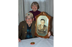 James Richardson, 99, a member of the famed Merrill's Marauders in Burma during World War II, poses with his daughter, Judy Robinson, in February 2020.