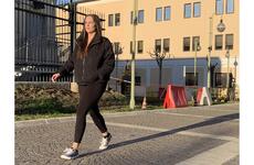 Navy Petty Officer 1st Class Caroline Crumbacker walks at Naval Support Activity Naples, Italy.