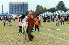People gather and dance on Balboni Field during the Humphreys Fall Festival at Camp Humphreys, South Korea, Oct. 15, 2022.