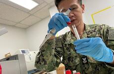 A hospital corpsman processes biological samples during a U.S. Naval Medical Research Unit Indo Pacific study on natural- and vaccine-derived immunity of respiratory diseases in U.S. sailors and Marines in September 2023.