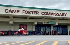 Children return an empty shopping cart outside the commissary at Camp Foster, Okinawa, Wednesday, Jan. 12, 2022. 