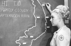 Barbara (Bobbie) Oberhansly delivers the weather forecast for Vietnam on Armed Forces Television in 1967. 