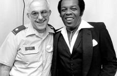 Lou Rawls, right, poses for a photo backstage during the Philippines portion of his 1983 USO tour of the Far East.