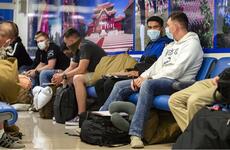 Marines wait inside the passenger terminal at Kadena Air Base, Okinawa, June 6, 2020.