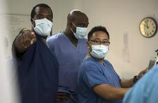 Navy Lt. Rodney Posley, left, an intensive care unit nurse with 3rd Medical Battalion at Camp Foster, Okinawa, trains a pair of hospital corpsmen.