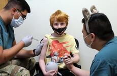 Will Henjum, 7, is the first to receive the Pfizer-BioNTech pediatric COVID-19 vaccine at Camp Humphreys, South Korea, Nov. 17, 2021.