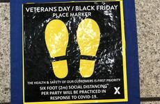 A floor decal reminds exchange patrons at Yokota Air Base in western Tokyo to practice social distancing during Black Friday shopping.