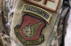 A security forces airman wears a "vaccinated" morale patch in this screenshot from the popular Air Force amn/nco/snco Facebook page.