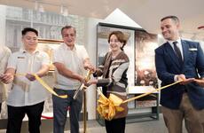 A framed painting by Fernando Amorsolo is on display.