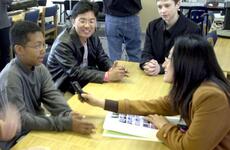 Cho Hyea-ran, a South Korean teacher, interviews pupil and volunteer guide Christopher Campbell, 13, Wednesday at Seoul American Middle School on Yongsan Garrison.