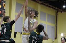 Yokota's Connor Rowan goes up for a basket Thursday while defended by Robert D. Edgren's Shamar Parnell, right, and Alec Struve. Edgren won 47-45 in the last game of the season for both teams as DODEA-Pacific and military officials decided to cancel the Far East boys tournament at Camp Humphreys, South Korea, due to concerns of the spread of the coronavirus.