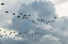 Hundreds of paratroopers assigned to U.S. Army Alaska jump onto Andersen Air Force Base, Guam, Tuesday, June 30, 2020.