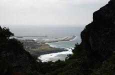 The view from near the top of Seongsan Ilchulbong, also called Sunrise Peak, which was created by a volcanic eruption under the sea. It was a stop on the UNESCO World Heritage tour on Sunday, Oct. 15, 2017, on Jeju Island, off the southern tip of South Korea.